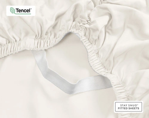 Close-up on the Stay Snug elastic sitting loose on our BeechBliss TENCEL™ Modal Fitted Sheet in Cloud White.