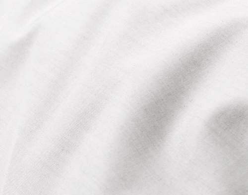 Close-up on the soft fabric over the surface of our Bamboo Cotton Duvet Cover in White.