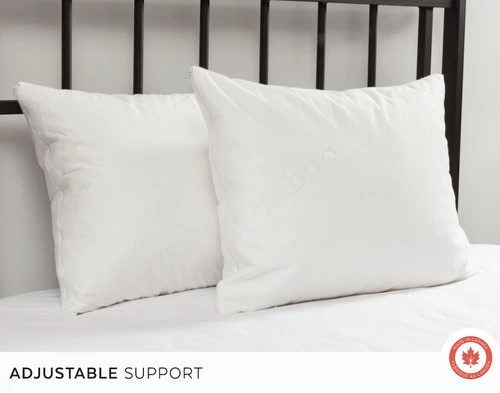 Kamboo Kapok Filled Adjustable Pillow leaning against a black bar headboard.