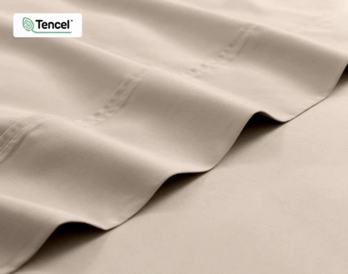 Close-up on the edge of the flat sheet for our Eucalyptus Luxe TENCEL™ Lyocell Sheet Set in Ash Beige.