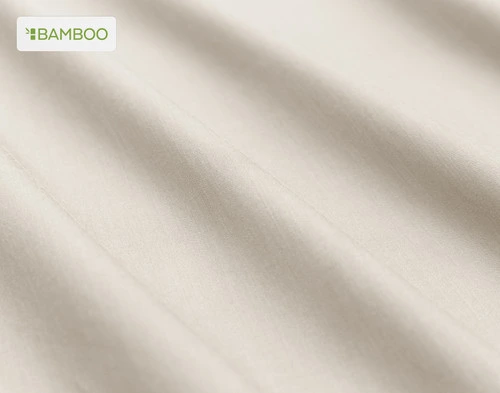 Close-up on the soft bamboo cotton fabric  on our Bamboo Cotton Sheet Set in Driftwood Beige slightly ruffled.