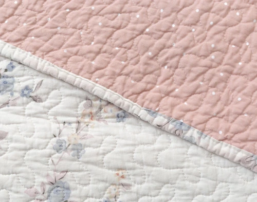 Side by side comparison of the Annalise Cotton quilt set white and botanical print and reverse light pink print.