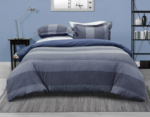 Front view of the Connor Linen Blend Duvet Cover Set featuring a horizontal striped pattern in shades of blue which reverses to a solid blue.