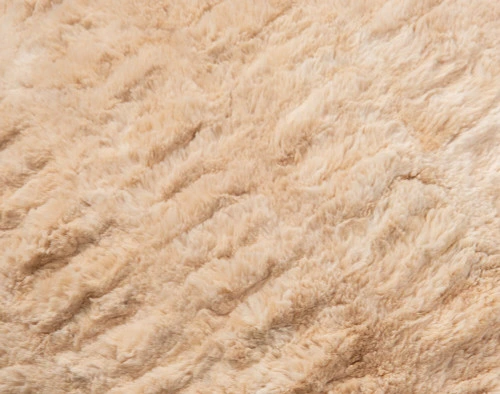 Carved Faux Fur Euro Sham in Caramel, a medium beige with orange undertones, texture close-up