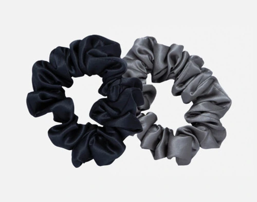 100% Mulberry silk scrunchies in black and pewter grey.