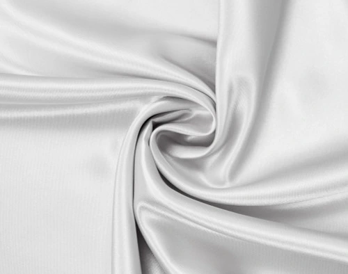 Close-up of White Satin Pillowcase with fabric curved