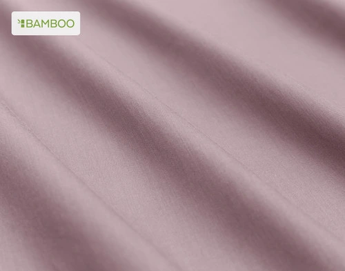 Close-up on the soft bamboo cotton fabric  on our Bamboo Cotton Sheet Set in Orchid Purple slightly ruffled.