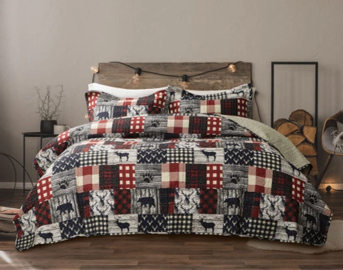 Our Purcell Cotton Quilt Set features a classic patchwork pattern of red plaid and grey & white animal designs.