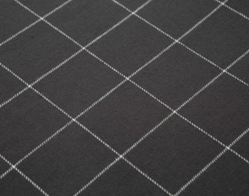 Close-up of the triple-brushed cotton fabric on our Alistair Black Flannel Duvet Cover Set.