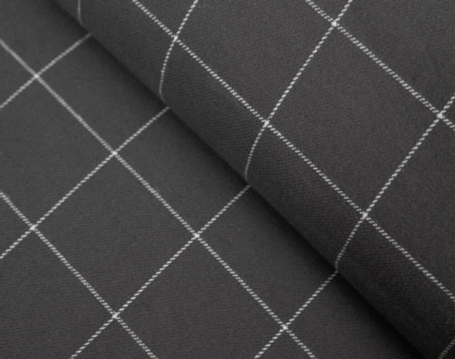 Close-up of the folded edge of a dressed bed in our Alistair Black Flannel Duvet Cover Set.