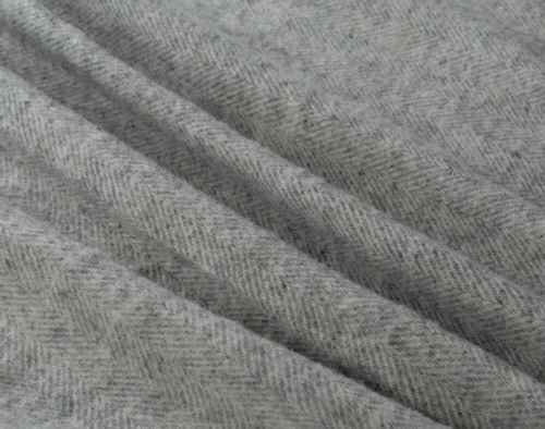 Our Wool Blend Grey Blanket in Lismore features a uniquely soft texture with dark undertones.