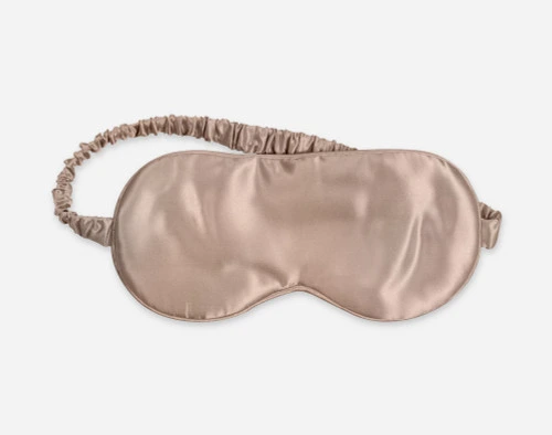 Close-up of our Silk Eye Mask in Bronze against a white background.