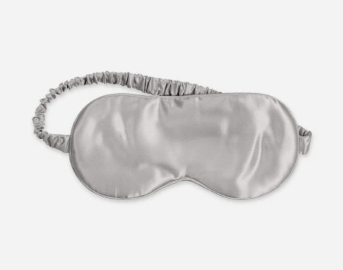 Close-up of our Silver Silk Eye Mask in Silver against a white background.