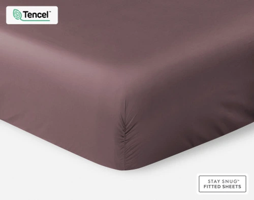 Our BeechBliss TENCEL™ Modal Fitted Sheet in Inkberry Purple over a mattress on a white background.