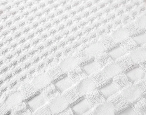 Close-up of our Waffle Cotton Euro Sham in White to show its mixed woven textures.