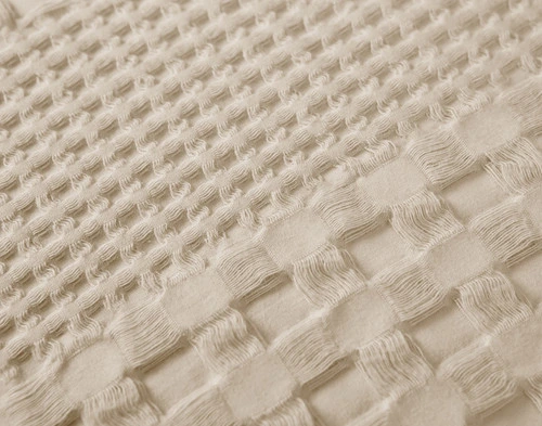 Close-up of our Waffle Cotton Euro Sham in Neutral to show its mixed woven textures.