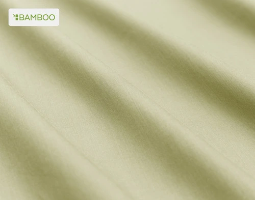 Close-up on the soft bamboo cotton fabric  on our Bamboo Cotton Sheet Set in Elm Green slightly ruffled.