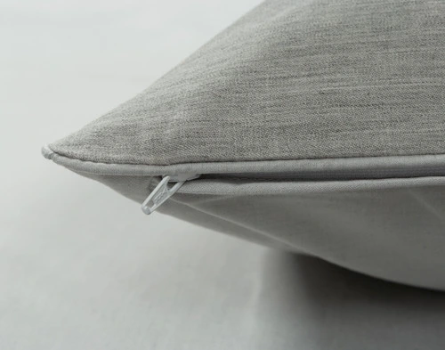 Corner of our Benito Pillow Sham to show its solid white sateen backing and zipper enclosure.