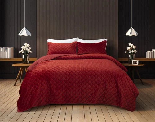 Front view of our Lattice Ruby Quilt Set dressed over a queen bed in a dark grey bedroom.