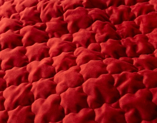 Close-up of the diamond top-stitch diamond pattern on our Lattice Ruby Quilt Set.