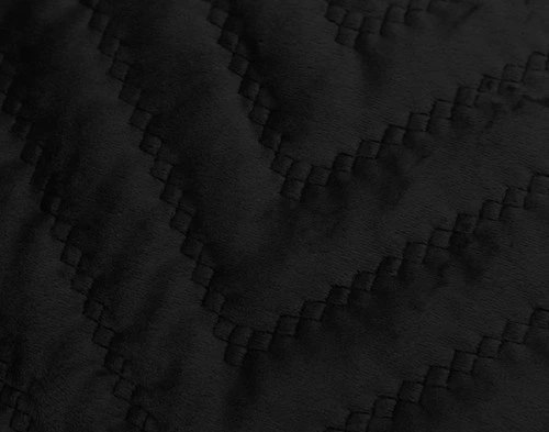 Close-up of the quilted texture of our Quilted Chevron Euro Sham in Black.