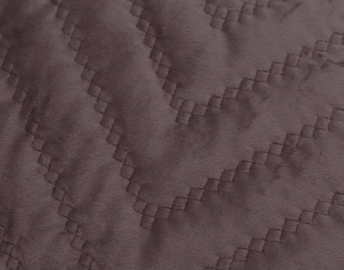 Close-up of the quilted texture of our Quilted Chevron Euro Sham in Woodrose Mauve.