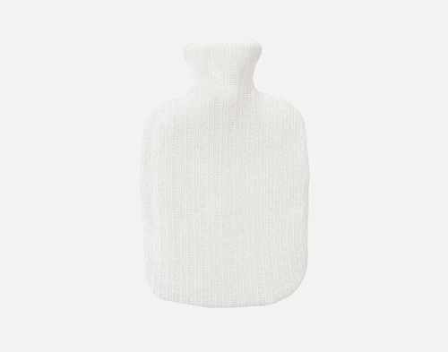 Top view of our Chenille Sherpa Hot Water Bottle in White sitting over a solid white background.