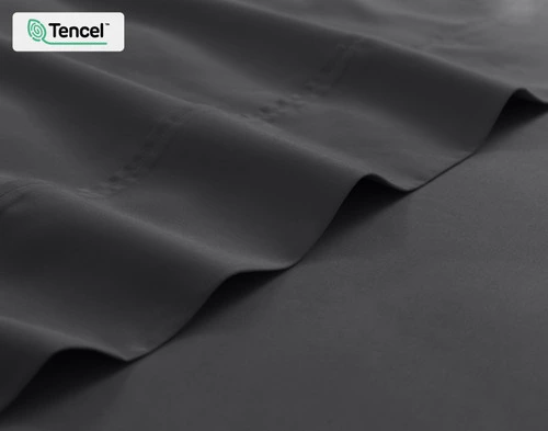 Close-up on the edge of the flat sheet for our Eucalyptus Luxe TENCEL™ Lyocell Sheet Set in Black Pearl.