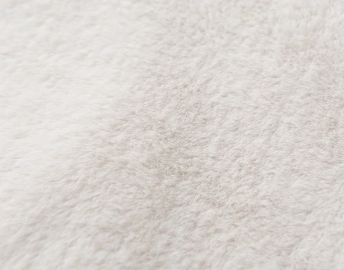 Close-up on our Puma Faux Fur Throw in Winter White to show its supreme softness.