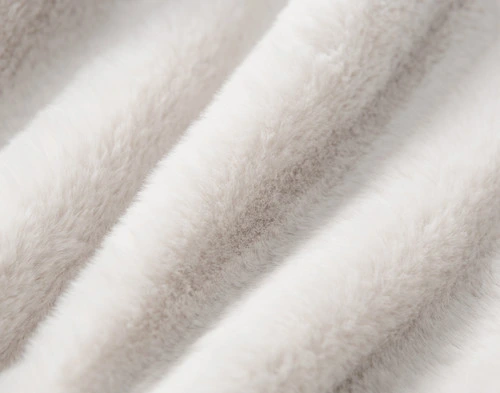 Close-up on ruffled faux fur surface on our Puma Faux Fur Throw in Winter White.