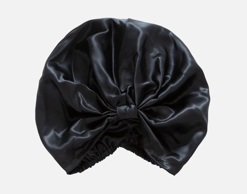 Top view of our Mulberry Silk Hair Wrap in Black sitting against a solid white background.