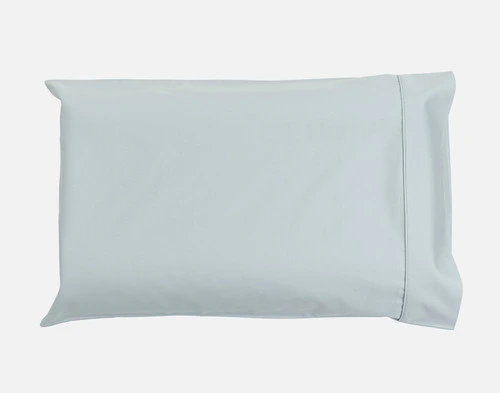 Our Small Bamboo Cotton Pillowcase in Sky Blue sitting against a solid white background.