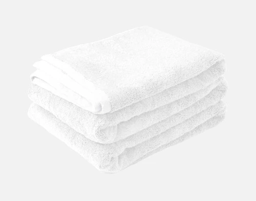 Our Modal Cotton Bath Sheets in White folded into a tidy pile.