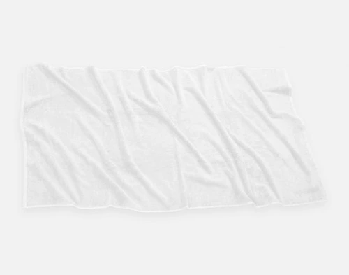 Top view of our Modal Cotton Bath Sheet in White laying ruffled over a solid ground.