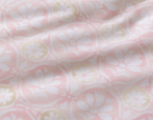 Close-up on the reverse on our Angelica Duvet Cover to show its pink trellis pattern.