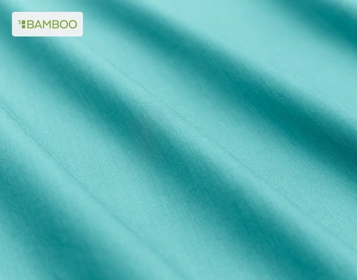 Close-up on the soft bamboo cotton fabric  on our Bamboo Cotton Sheet Set in Reef Blue slightly ruffled.