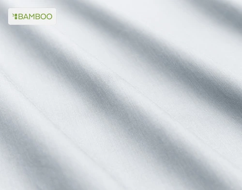 Close-up on the soft bamboo cotton fabric  on our Bamboo Cotton Sheet Set in Pearl Blue slightly ruffled.