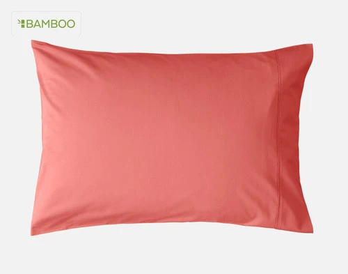 Front view of one of our Bamboo Cotton Pillowcase in Hibiscus, a bright red-ish pink, sitting against a solid white background.