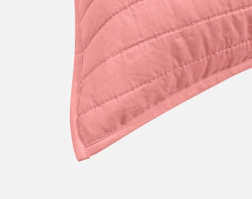 Close-up on the light flanged edge on the corner of our Linen Cotton Euro Sham in Fuchsia.