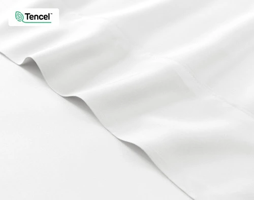 Close-up on the fitted and flat sheet of our BeechBliss TENCEL™ Modal Sheet Set in White to show its silky soft surface.