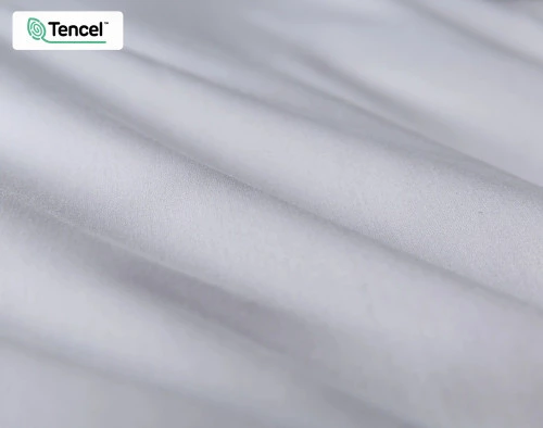 Close-up of our Eucalyptus Luxe TENCEL™ Lyocell Duvet Cover in Silver to show its fabric lightly ruffled.