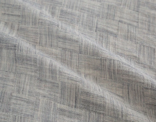 Close-up on our Landon Duvet Cover to show its heathered grey surface.