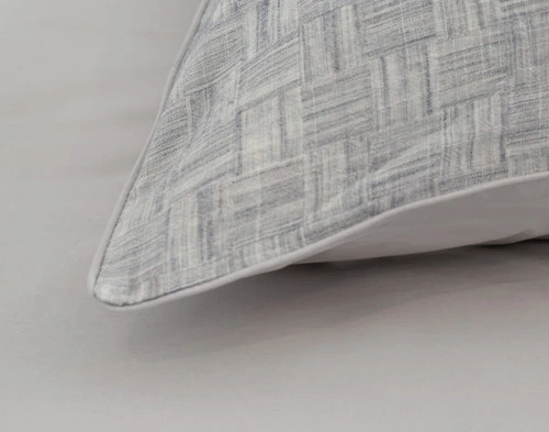 Close-up view of our Landon Pillow Sham to show its piped edge border on its corner.