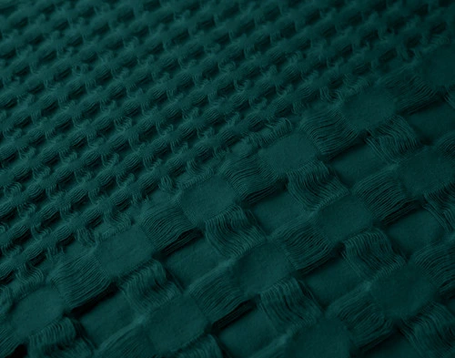 Close-up on the textured waffle surface on our Waffle Cotton Euro Sham in Teal Green.