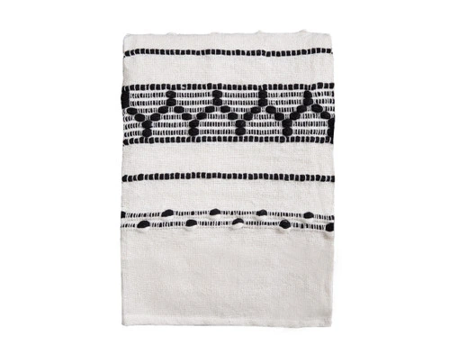 Our Artisanal Throw in Kavi folded into a tidy square.