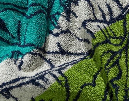 Close-up on the tropical plant pattern on our Paradiso Cotton Beach Towel.