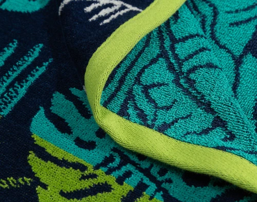 Close-up on the green border on the edge of our Paradiso Cotton Beach Towel.