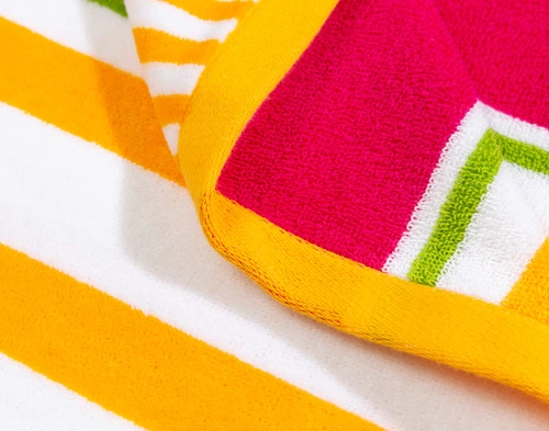 Close-up on the orange border on the edge of our Capri Cotton Beach Towel.