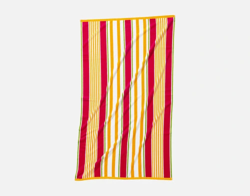 Front view of our Capri Cotton Beach Towel spread vertically in front of a solid white background.