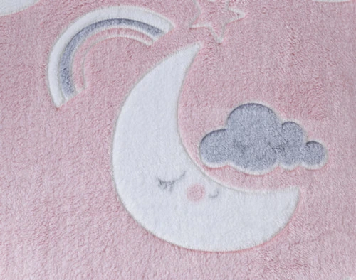 Close-up on our Goodnight Cloud Glow in the Dark Fleece Throw to show its smiling cloud pattern and pink surface.